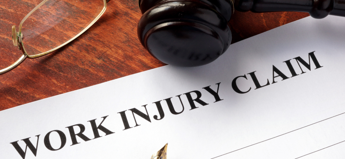 A work injury claim document on a lawyers desk.