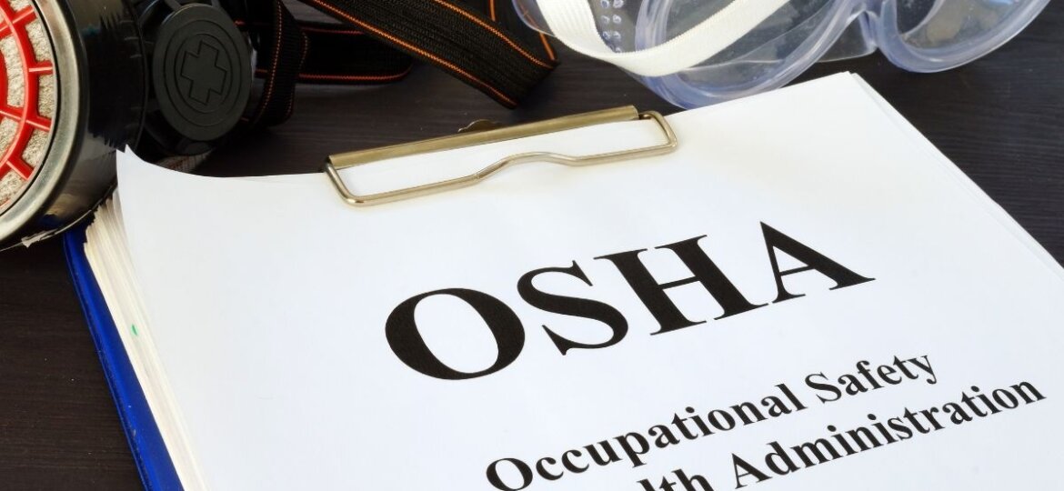 An Osha handbook attached to a clipboard.