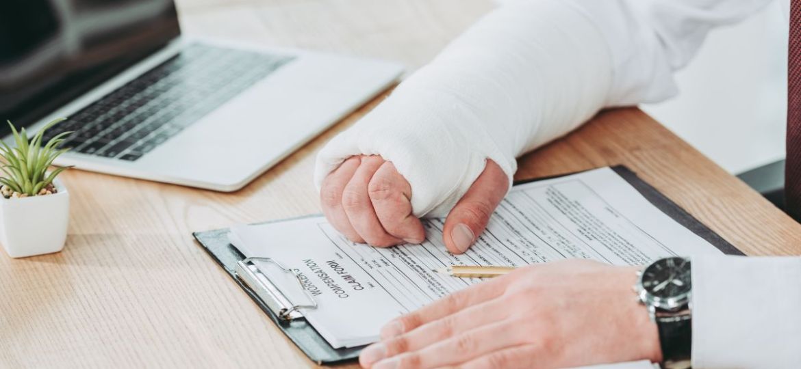 An injured person is reading a workers comp settlement form.