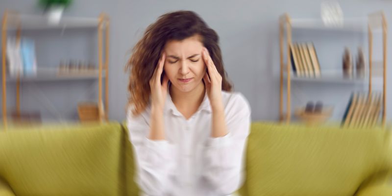 The woman is not feeling well after having a concussion.