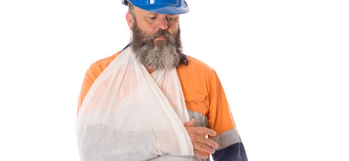 An injured worker contemplating the advantages of filing for workers comp vs. disability.