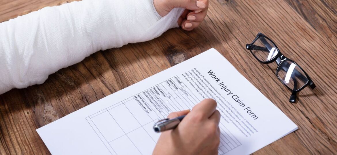 An injured illegal immigrant worker who fills out a workers' injury claim form to obtain compensation.