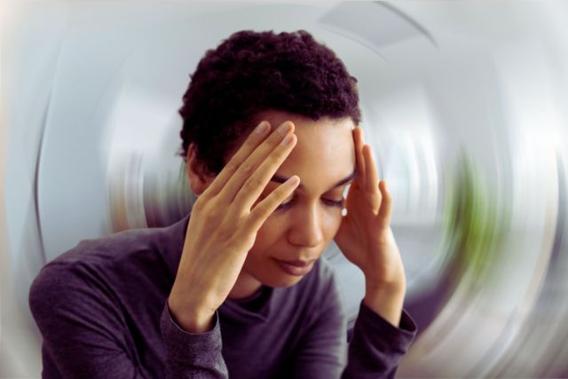 The woman has vertigo.