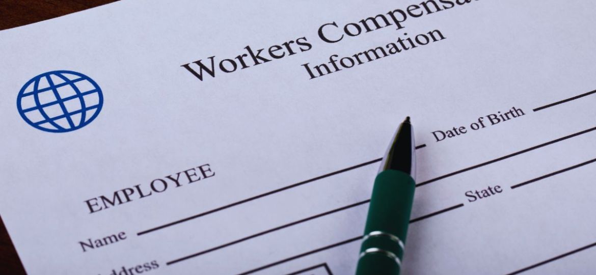 Workers' compensation claim form on a desk with pen, showing fields for injury details and employee info, relevant when asking does workers comp pay for lost wages during recovery